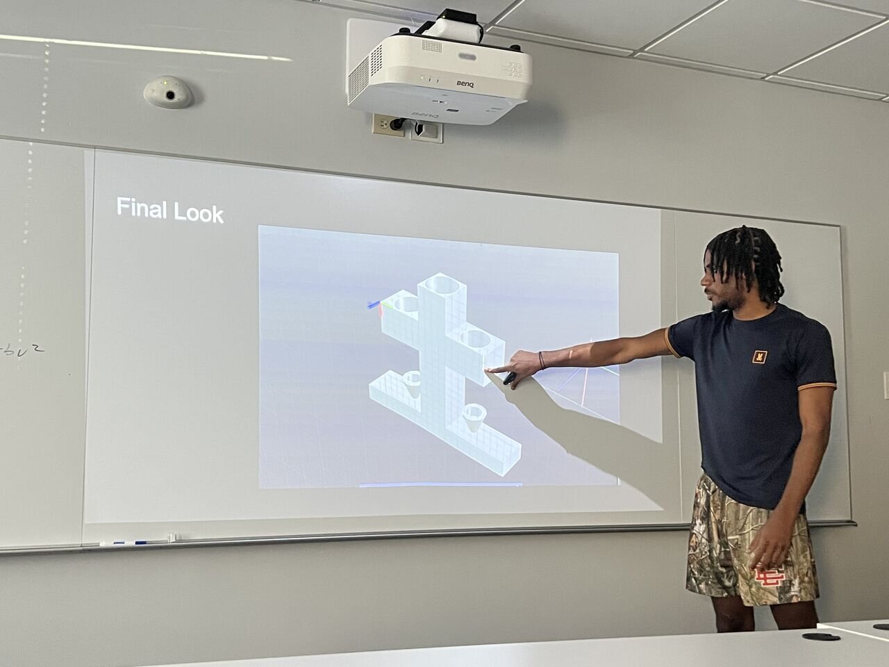 A student presenting a CAD model