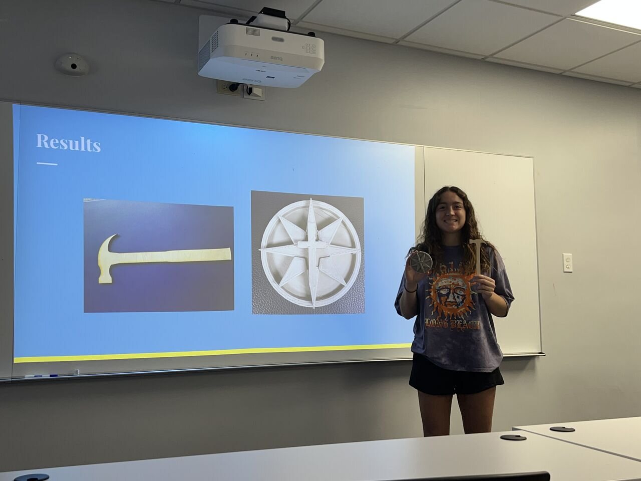 A student presenting 3D-printed project results
