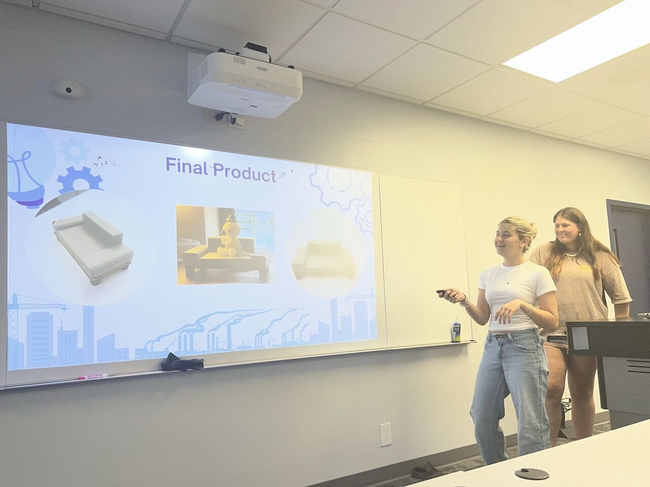 Students presenting a fabricated furniture concept