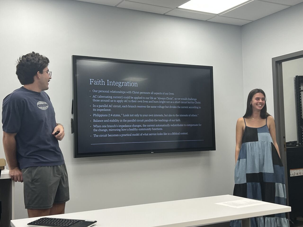 Students presenting an electrical circuits laboratory project