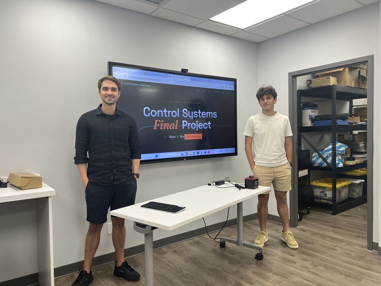 Students presenting a control systems final project